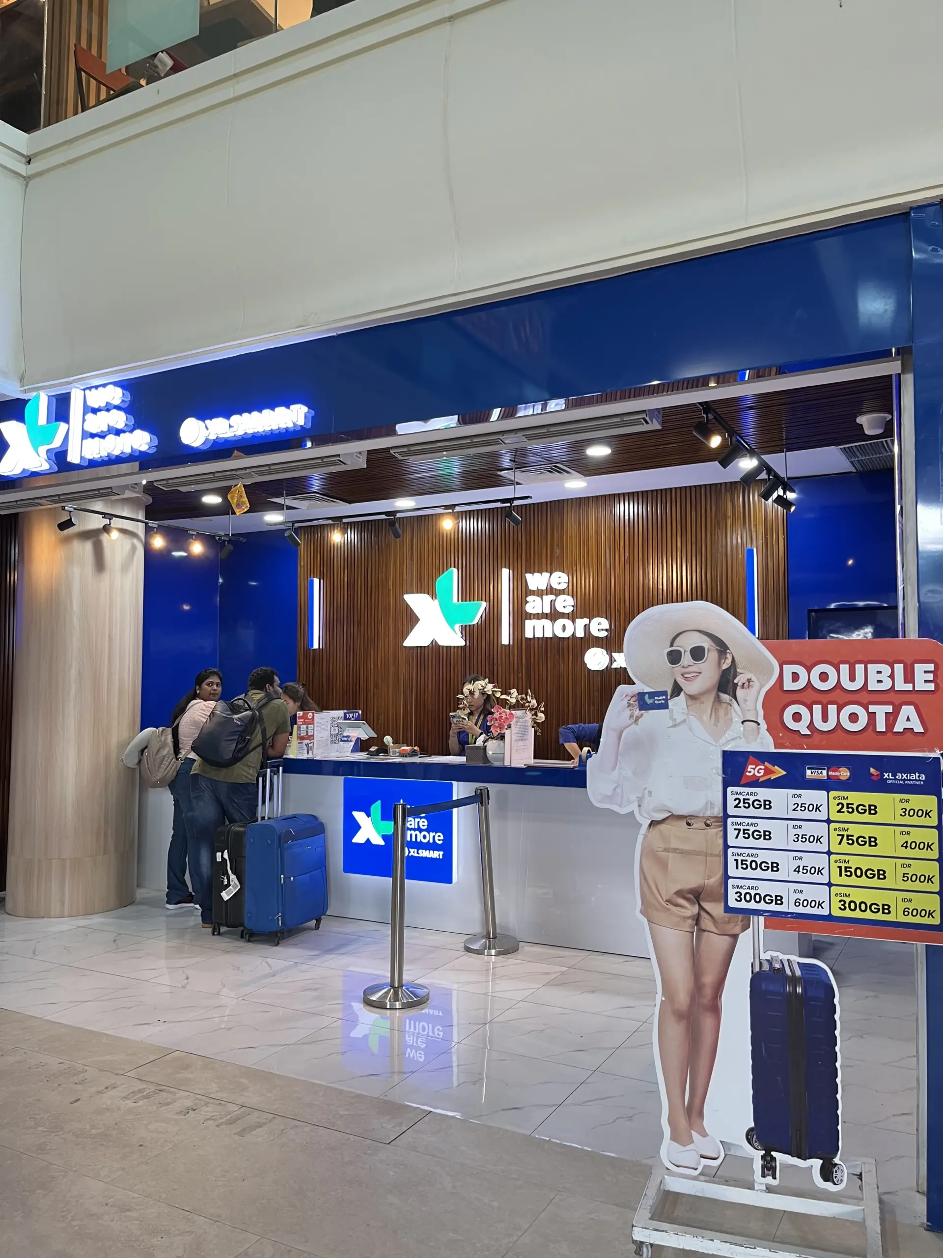 Front view of the XLSMART airport counter for Bali SIM card and eSIM pickup